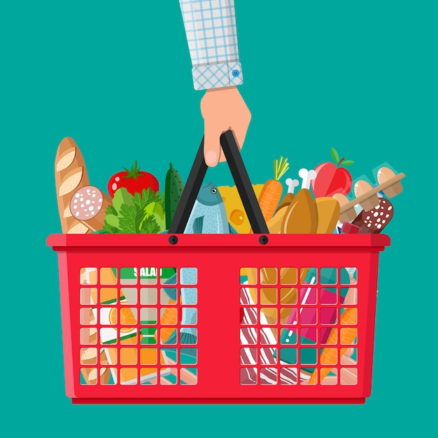 Plastic shopping basket full of groceries products