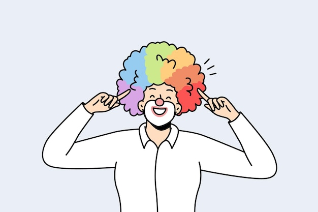 Portrait of male clown with rainbow hairstyle