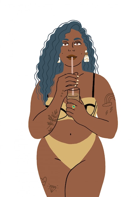 Portrait of a woman drinking from a straw in a swimsuit on the beach.