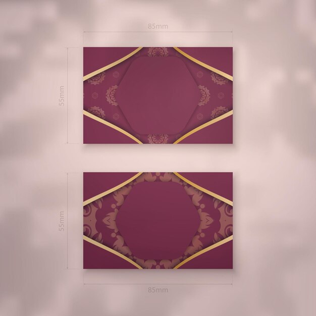 Vector a presentable burgundy business card with an antique gold pattern for your contacts.