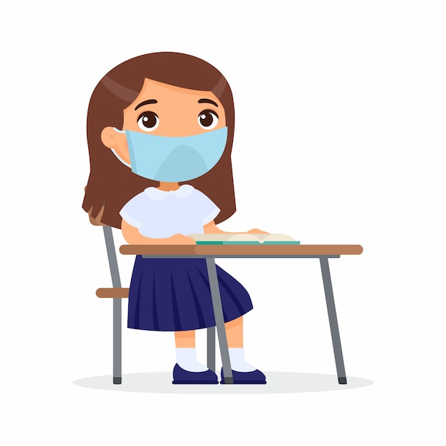 Pupil at lesson with protective mask on her face. Schoolgirl is sitting in a school class at her desk