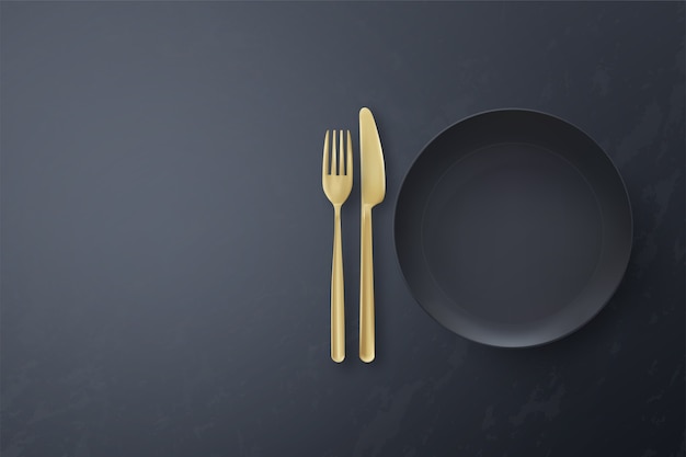 Realistic blank black plate with cutlery on black background