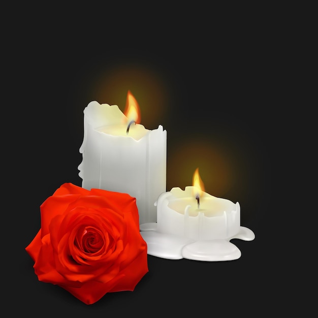 Realistic candles and rosebud on a black background