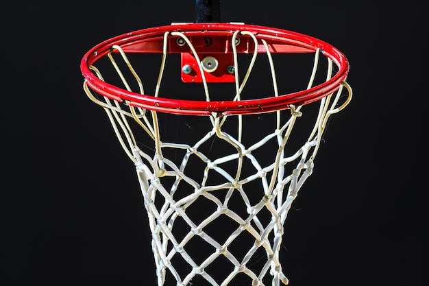 a red basketball hoop with a silver chain and white net