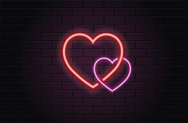 Red and pink heart for valentines day on black brickwall background. Neon logo