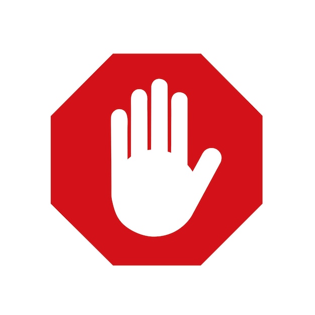 A red stop sign with a white hand on a white background with copy space