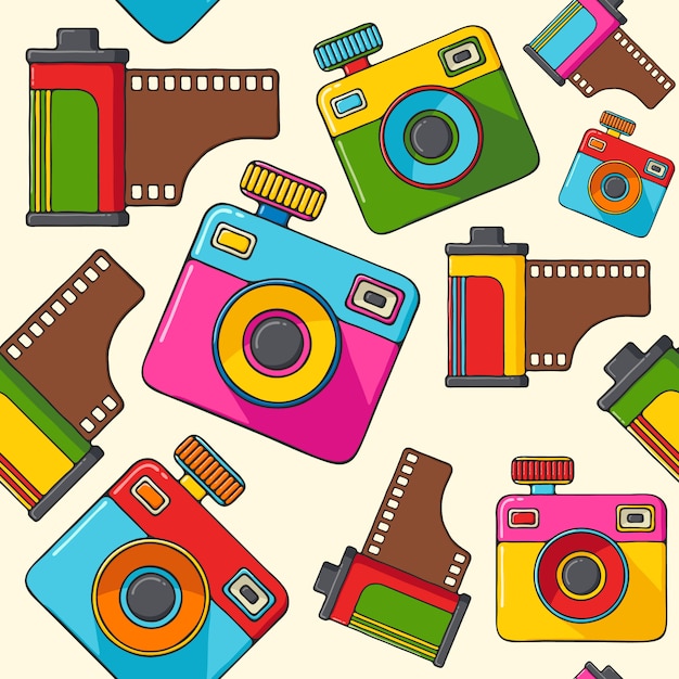 Retro cameras and camera rolls hand drawn pop art style seamless pattern.