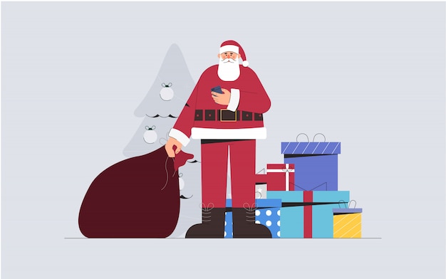 Santa Claus holds a bag of gifts and phone