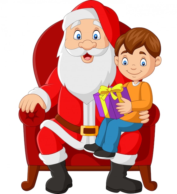 Santa claus sitting in chair with a little cute boy