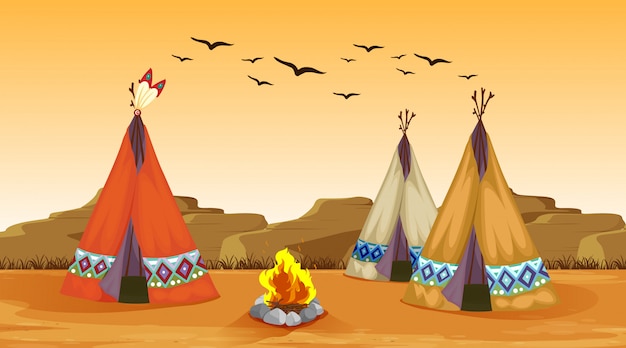 Scene with campfire and tents in the desert