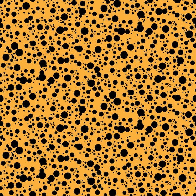 Seamless pattern with black dots on orange Color of Halloween