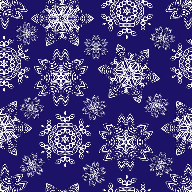 Seamless pattern with white christmas snowflakes on blue background