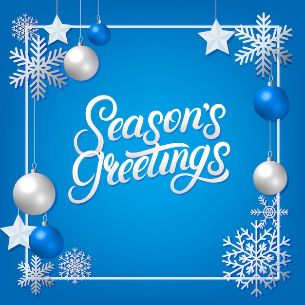 Seasons greeting hand written lettering with silver decoration ornament.