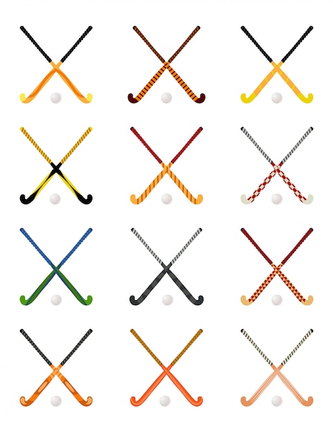 Set of crossed hockey sticks on grass