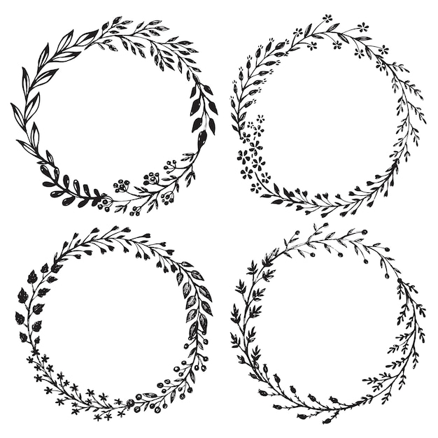 Set of hand drawn floral wreaths with leaves, flowers, berries.