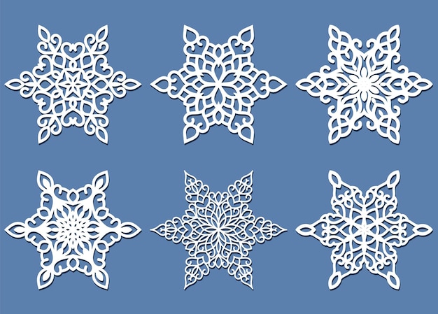 Set of laser cutting snowflakes isolated on blue