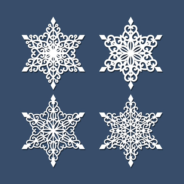 Set of laser cutting snowflakes isolated on blue