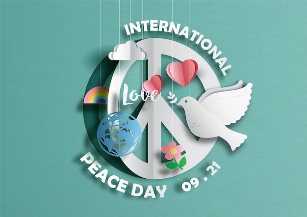 Sign and symbols of International Peace Day in paper cut style on green  background