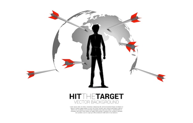 Silhouette of businessman standing with arrow archery hit on the globe Business Concept of global marketing target and customerCompany vision mission and goal