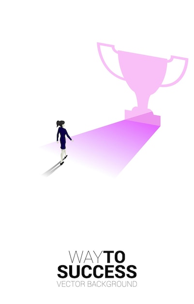 Silhouette businesswoman walking to light from exit door shape trophy Business Concept of route to winner and champion