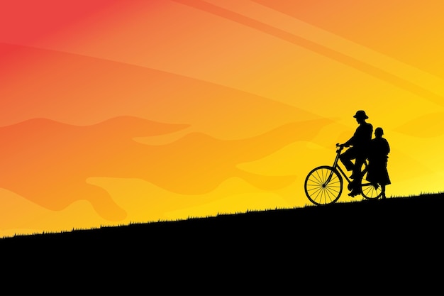 Silhouette of cycling with a woman in the sunset