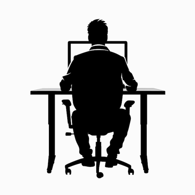 Silhouette of a person working on a computer at a desk