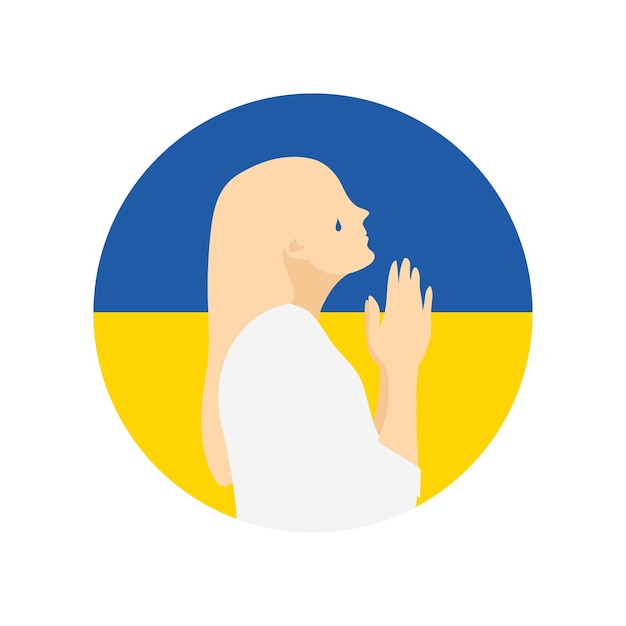 Silhouette of praying woman with the national Ukrainian flag on background