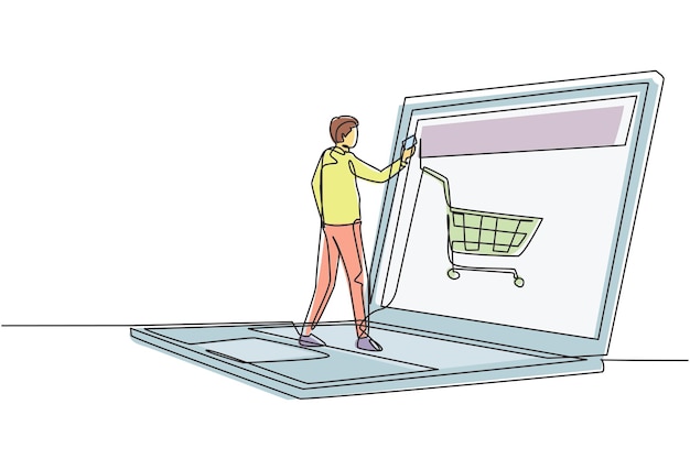 Vector single continuous line drawing young male shopping online via giant laptop screen with shopping cart