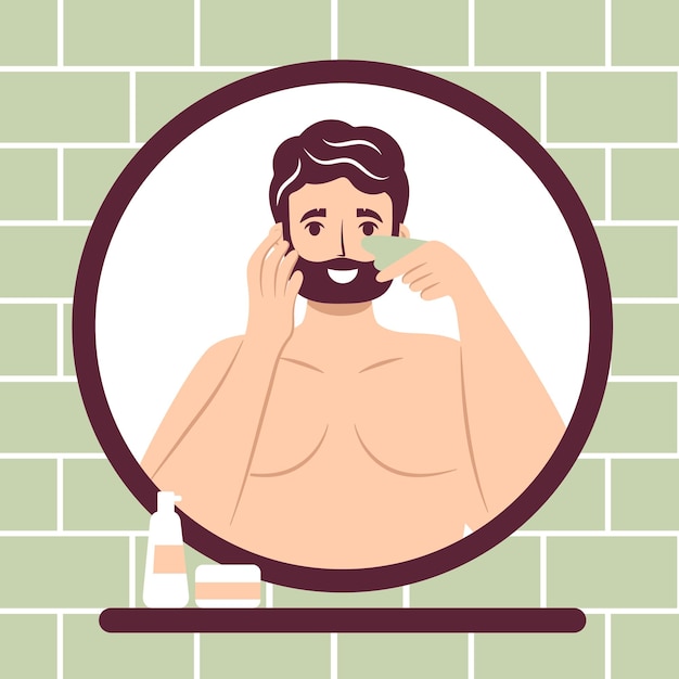 Skincare routine concept Close up mirror reflection happy young man doing lymphatic face massage with jade face gua sha stone scraper handsome bearded male enjoying skincare procedure Men hygiene