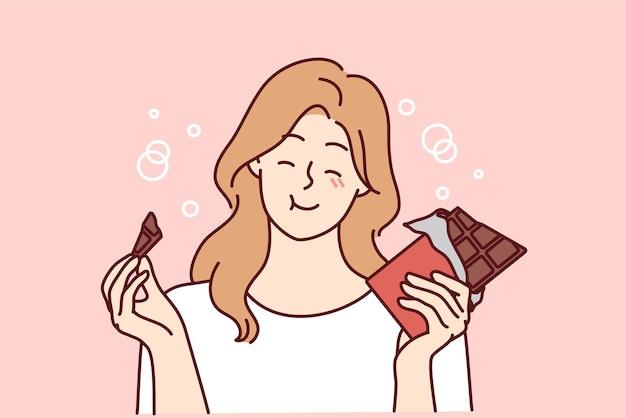 Smiling girl eating chocolate bar