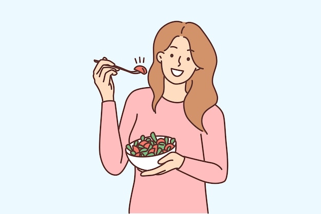 Smiling woman eating salad