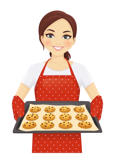 Smiling woman holding baking tray with homemade cookies wearing apron