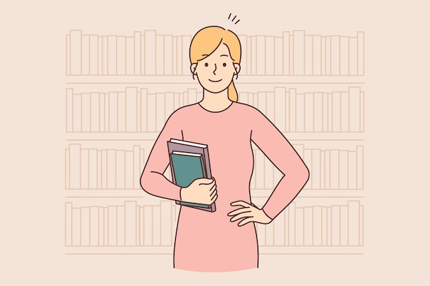 Smiling woman holding books standing in library