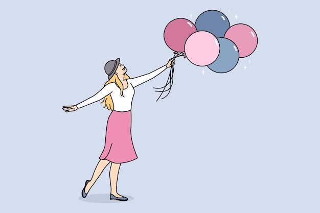 Smiling woman with bunch of balloons