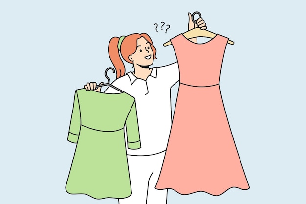 Smiling woman with dresses on hangers