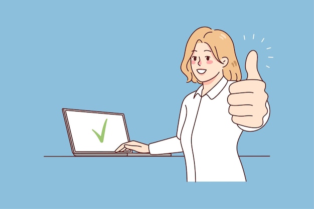 Smiling woman working on laptop showing thumb up