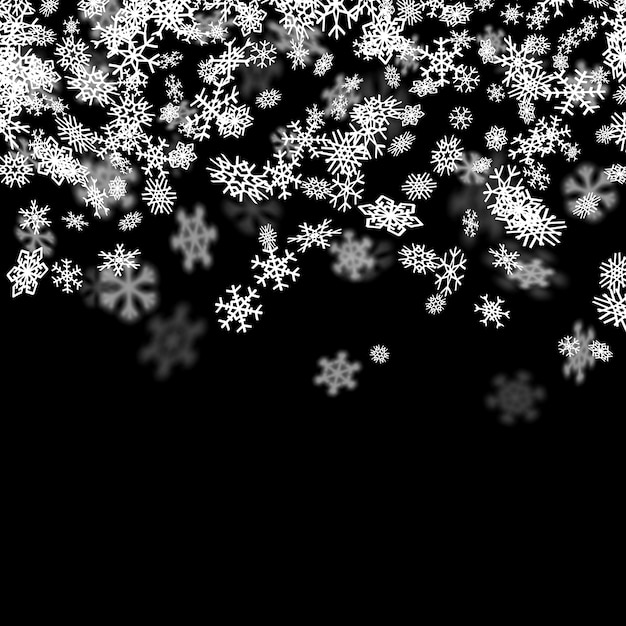 Snowfall background with snowflakes blurred in the dark