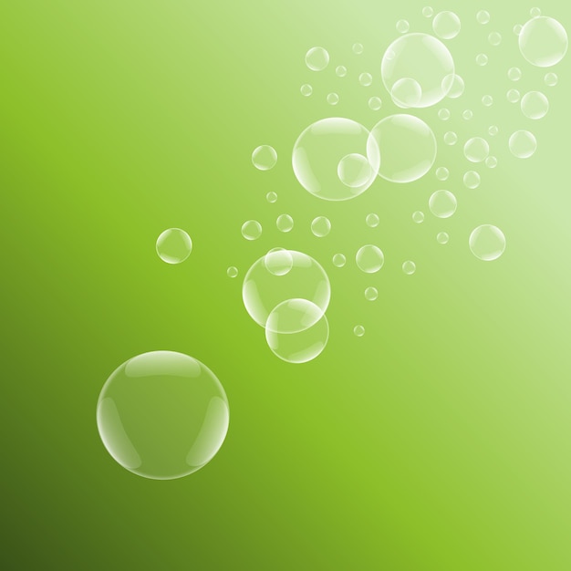 Soap bubbles on green background