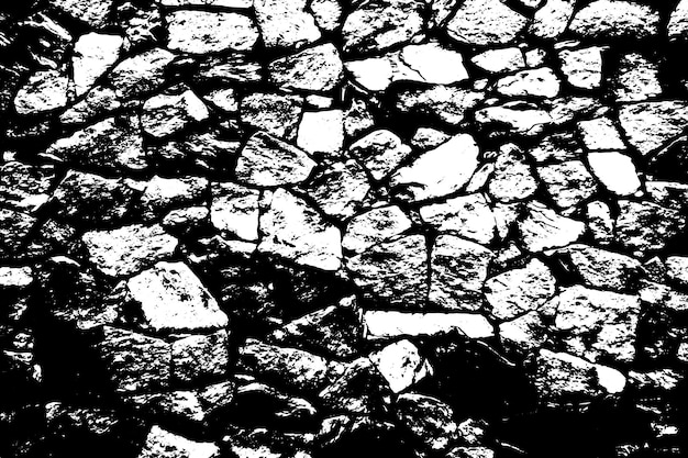 A stone wall with a black and white background.