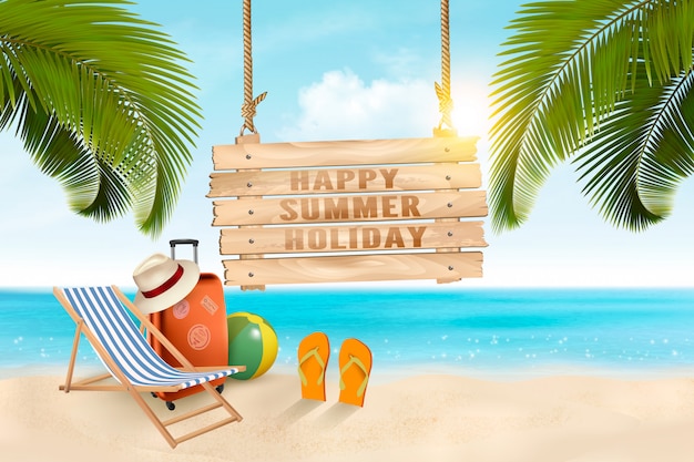 Summer vacation concept background.  Travel items on the beach. .