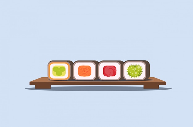 sushi set rolls on wooden board traditional japanese kitchen concept  horizontal