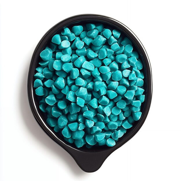 Vector teal chocolate chips in a black bowl