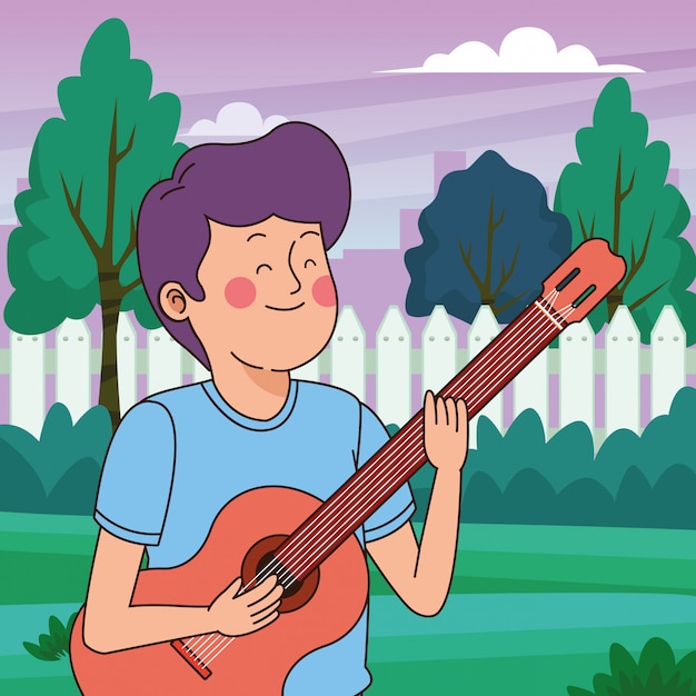 Teenager boy playing the guitar