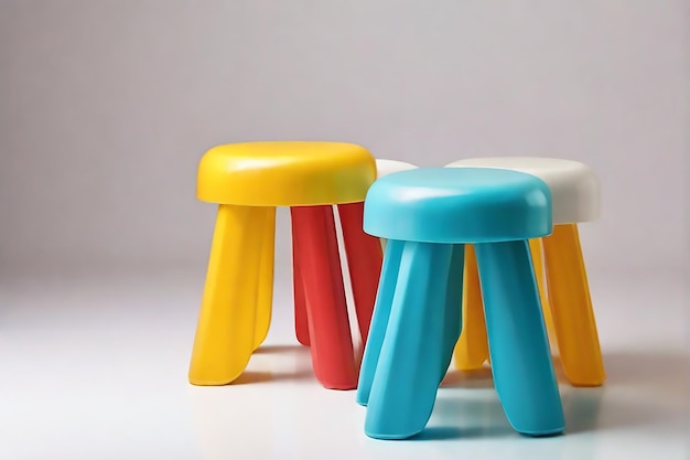 three colorful stools are next to each other and one has a red topplastic stool for kids isolated o