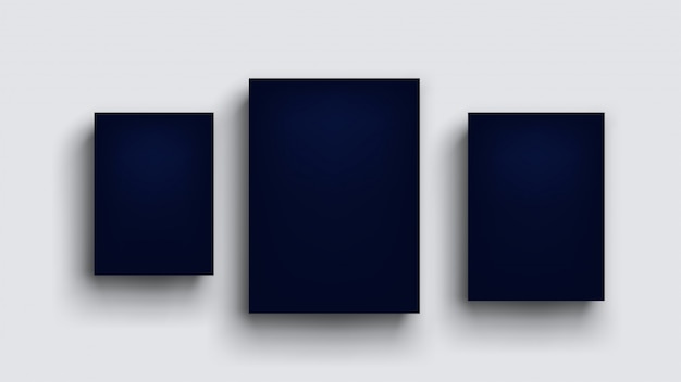 Three dark blue boards on grey wall