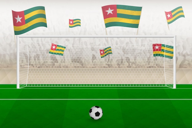 Togo football team fans with flags of Togo cheering on stadium penalty kick concept in a soccer match