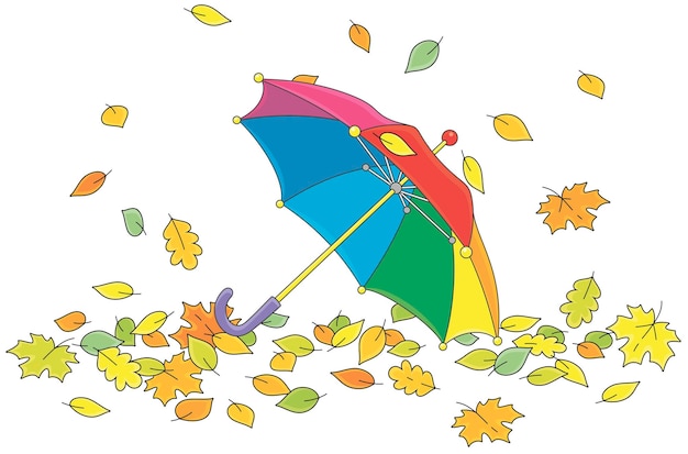 Toy kids umbrella among colorful fallen autumn leaves in a park