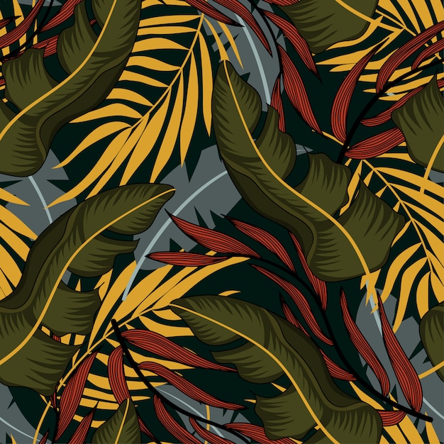 Trending abstract seamless pattern with colorful tropical leaves and plants on blue background