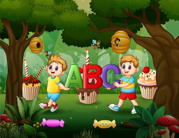 Two boy holding ABC letter in the sweet forest