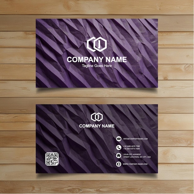 two business cards with purple and black letters on a wooden background